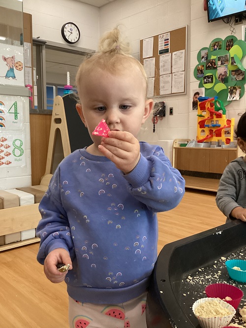 A toddler discovering a triangle 