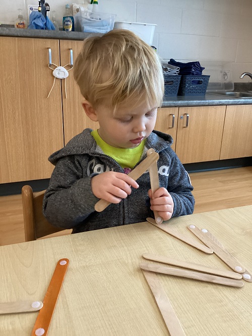 A child exploring with velcro sticks