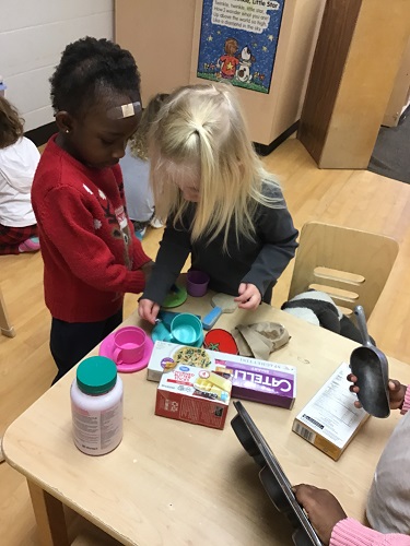 Preschoolers engaged in dramatic play