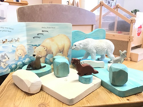 Display of Arctic animals and icebergs along with Penguin story