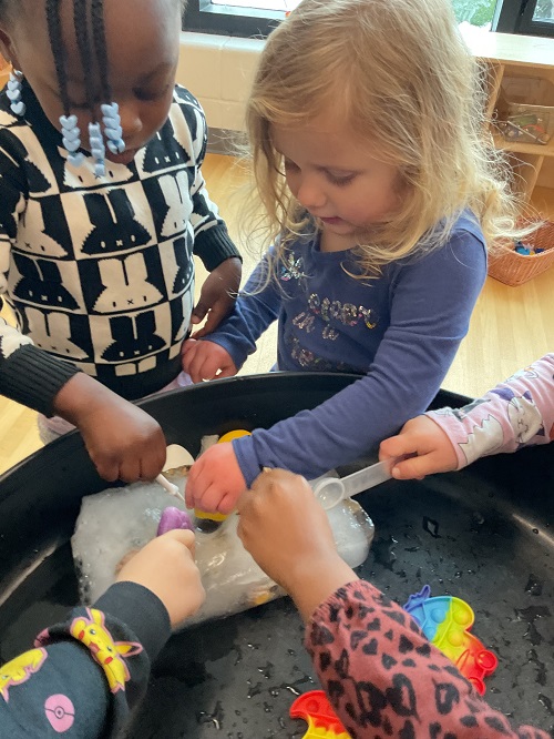 2 children digging ice