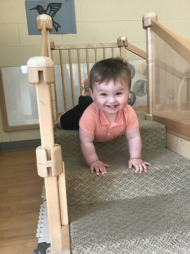 An infant on the climber