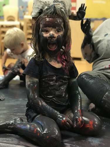 Child covered in paint