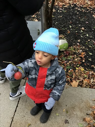 A child holding an apple