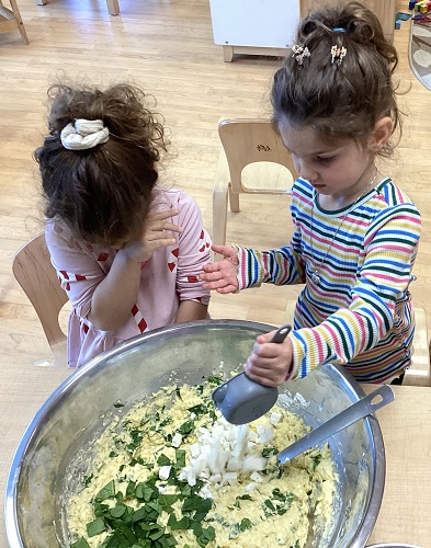 Children adding ingredients