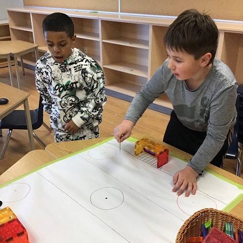 Children playing table hockey